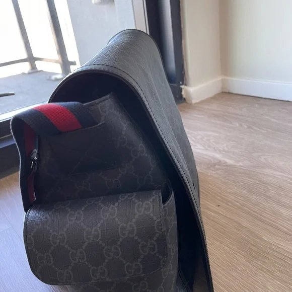 I am selling a Gucci x Supreme Diaper Bag
